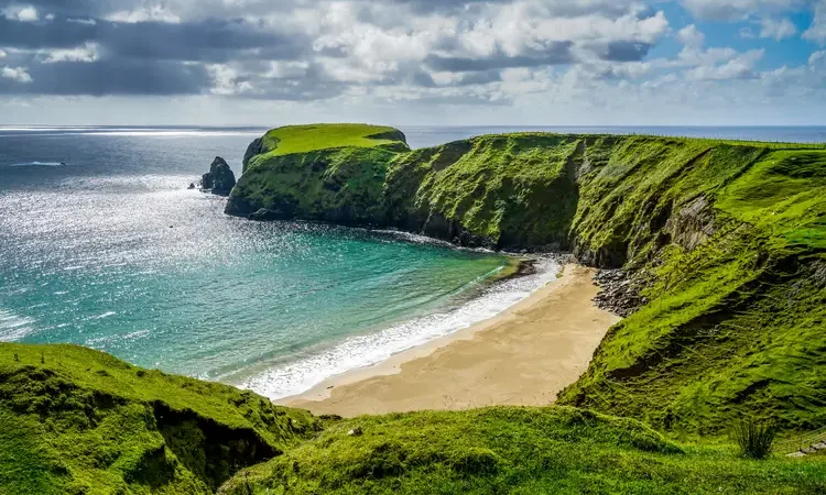 Crescent shaped beach in Glencolumbkille Ireland.